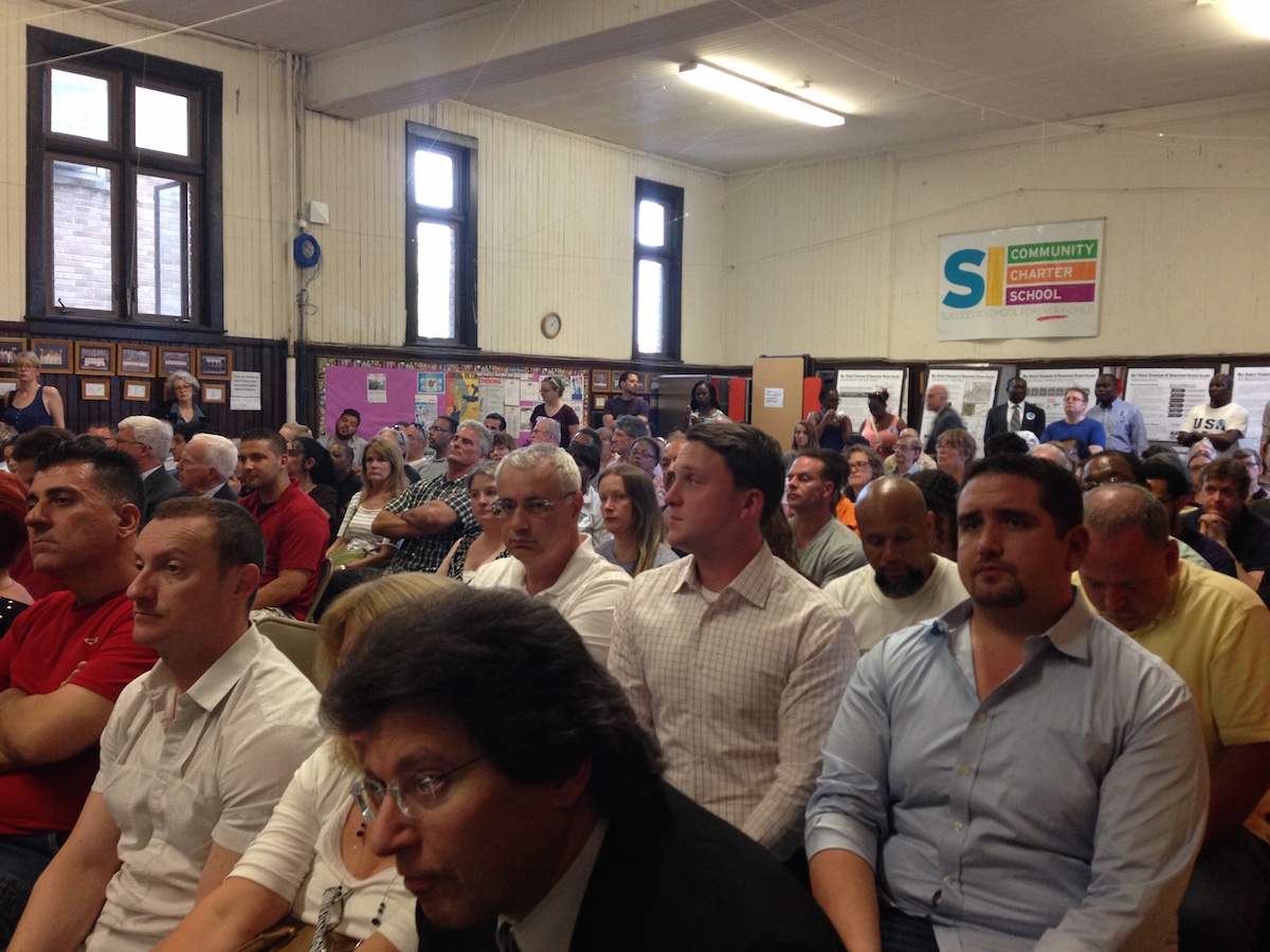 A packed house listens during DCP's meeting on the Bay Street corridor rezoning.