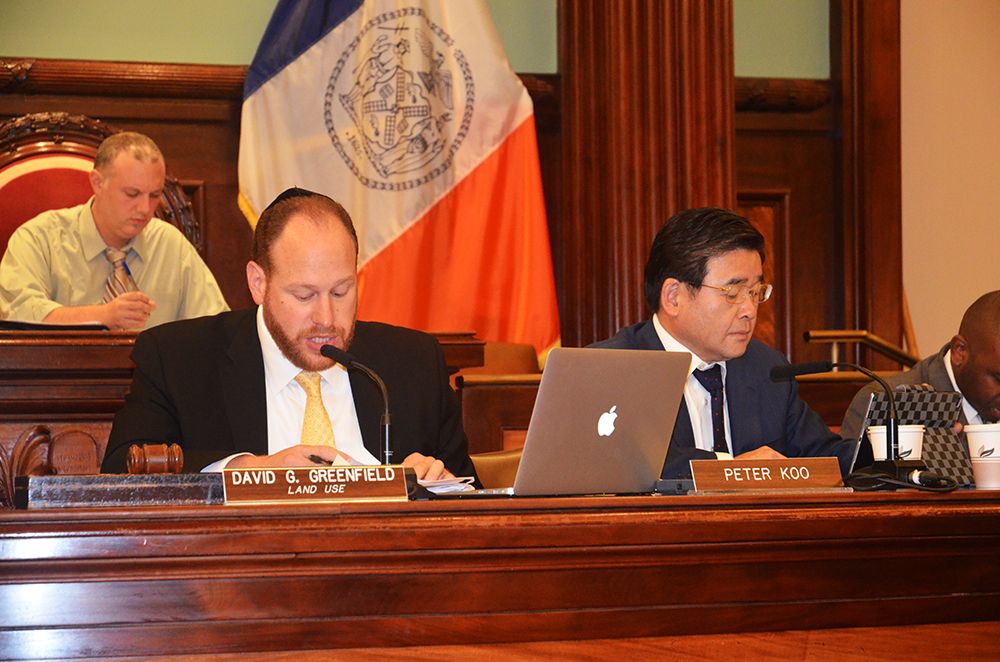 Council members David Greenfield and Peter Koo lead a public hearing on Intro 775 last September.